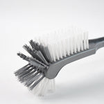 Long handle toilet cleaning brush shown angled for under-rim reach