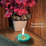 Multiple Silicone Diwali Diyas glowing with warm light, enhancing festive decor.