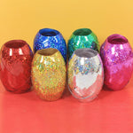 Multicolor curling ribbon rolls displayed for festive party decorations.