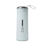 Durable glass water bottle with a protective grey silicone sleeve and bamboo lid for a firm grip.