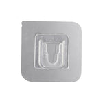 Transparent self-adhesive wall hook ready for easy peel-and-stick application.