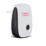 A white and black pest repeller with a black button and silver ring is shown on a white background.
