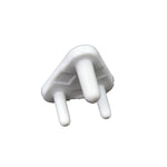 A single white plastic child safety socket cover, triangular with three prongs, viewed from an angle on a white background.