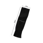 Black elbow compression sleeve on arm showing flexible fabric