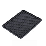 A black rectangular anti-skid mat with a diamond textured surface is displayed on a white background.