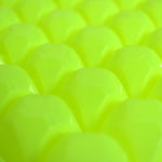 A stream of water filling the easy release ice tray cavities.