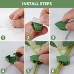 Multiple green leaf-shaped plant climbing clips displayed against a clean white surface.