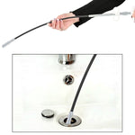 Demonstration of the Drain Cleaner Tool removing hair from a bathroom sink drain.