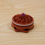Plastic spinning top with spark effects