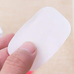 Compact mini box containing travel paper soap sheets for easy portability