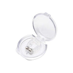 A hand gently holding the lightweight silicone anti-snore nose clip.