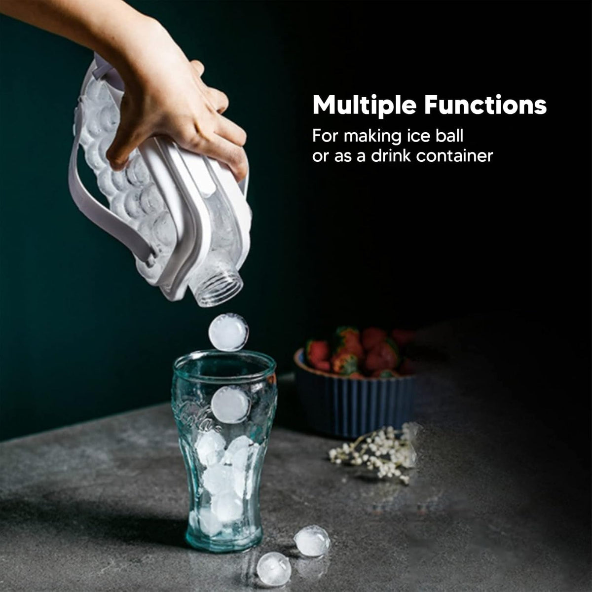 A hand dispenses ice balls from a white bottle into a glass, with strawberries in a bowl and text about multiple functions.