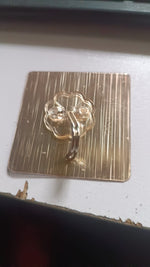 Clear adhesive hook fixed on smooth wall surface
