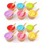 Arrangement of colorful dessert bowls and spoons ready for serving.