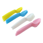 Disposable plastic spoon set on white background