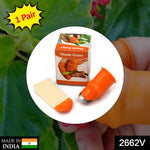 The V Thumb Cutter held on a thumb, ready for peeling vegetables.