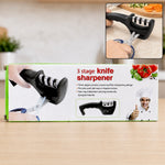 A black three-stage knife sharpener and a pair of blue-handled scissors are shown on a product box.