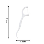 A white dental floss pick is shown with dimensions: 7 cm in length and 1.5 cm in width.