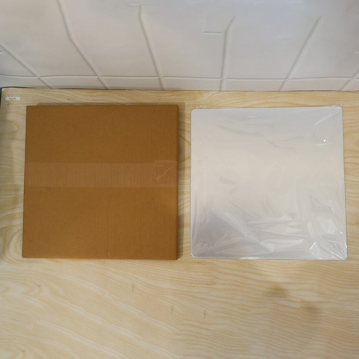 Brown box packaging for the Square flexible mirror sticker
