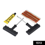 A tire repair kit with two T-handle tools, a yellow tube of rubber solution, and three brown repair strips in plastic.