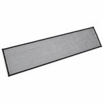 A rectangular piece of black mesh safety net with black fabric edges lies flat on a white surface.