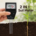 Hand holding soil pH and fertility meter with a seedling