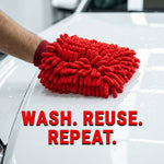 A hand wearing a red microfiber chenille wash glove cleans the white hood of a car, with the text "WASH. REUSE. REPEAT."