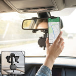 Car rear view mirror phone holder in use
