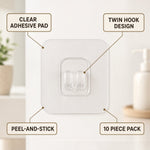 A clear adhesive hook with twin prongs is shown with text labels pointing to its features: clear pad, twin hook,