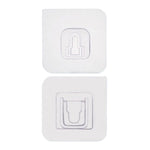 Adhesive wall hooks holding various kitchen utensils, showcasing their versatile use.