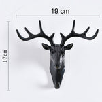 Stylish deer head hook in grey, functioning as a decorative hanger for a hat.