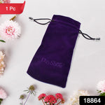 A single purple velvet drawstring bag with a DayShow logo lies on a white surface surrounded by pink and white flowers.
