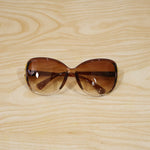 Detailed view of oversized sunglasses' frame and temple design.