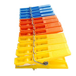 Pack of 12 strong grip laundry pegs in bright colours, essential for every home.