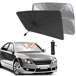 Foldable car sunshade in use, deployed on a car's windshield to block sun.