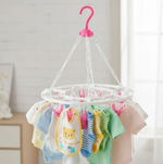 Close-up of the durable plastic clips on the multicolour drying stand.
