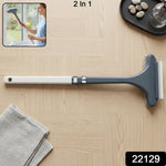 2 in 1 glass cleaner with scrubber and squeegee on a glass surface