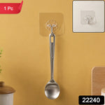 A silver spoon hanging from a transparent self-adhesive hook on a yellow wall, with a close-up inset and '1 Pc' and '22240'