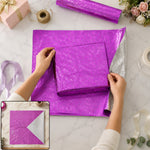 Metallic floral paper wrapping a gift box