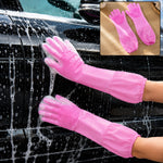 A person wearing pink silicone scrubbing gloves washes a black car, with a small inset showing the gloves. – view 7