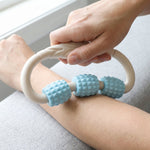 Use of muscle roller massager on arms and legs