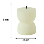 A single cream-colored, ribbed, hourglass-shaped LED candle with a black wick shows dimensions of 8 cm height and 4.5 cm