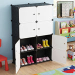 Black and white modular storage cabinet with four open compartments displaying children's shoes.