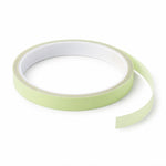 Fluorescent glow tape roll on white background