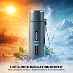 A blue insulated bottle with a silver cap stands on ice cubes, with a hot desert scene on the left and a cold mountain scene