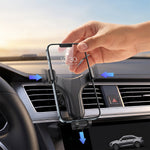 A hand removing a phone from a black gravity lock car phone holder mounted on an air vent, with blue arrows indicating the