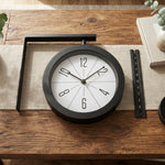 Modern round clock displayed on table