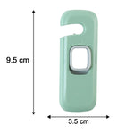A green and grey child safety lock with dimensions of 9.5 cm length and 3.5 cm width indicated by arrows.