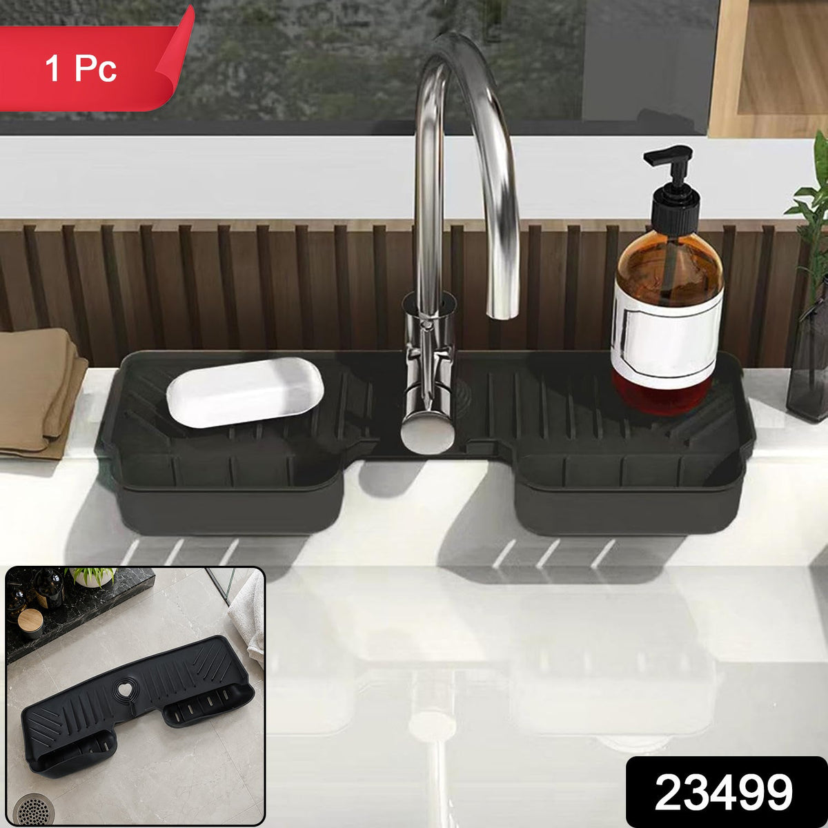 A black silicone faucet splash guard with a bar of soap and a pump bottle on a white kitchen sink, with a red "1 Pc" label