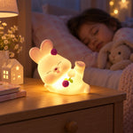 Close up of the reclining rabbit night light's face and details